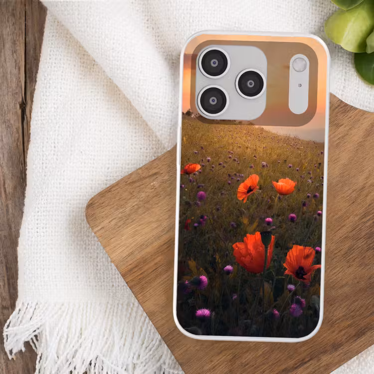 Bloemenveld - Gras - Bloemen - Planten - Zonsondergang - Oranje Telefoonhoesje iPhone 17 Pro klein -sfeer1