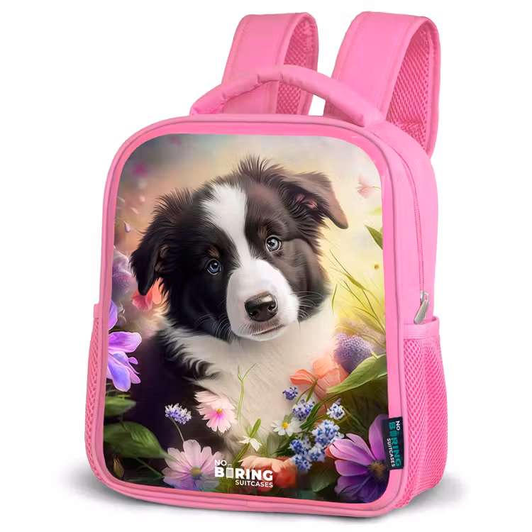 Hond met blauwe ogen in een veld Kinderrugzak - Roze middel -schuin