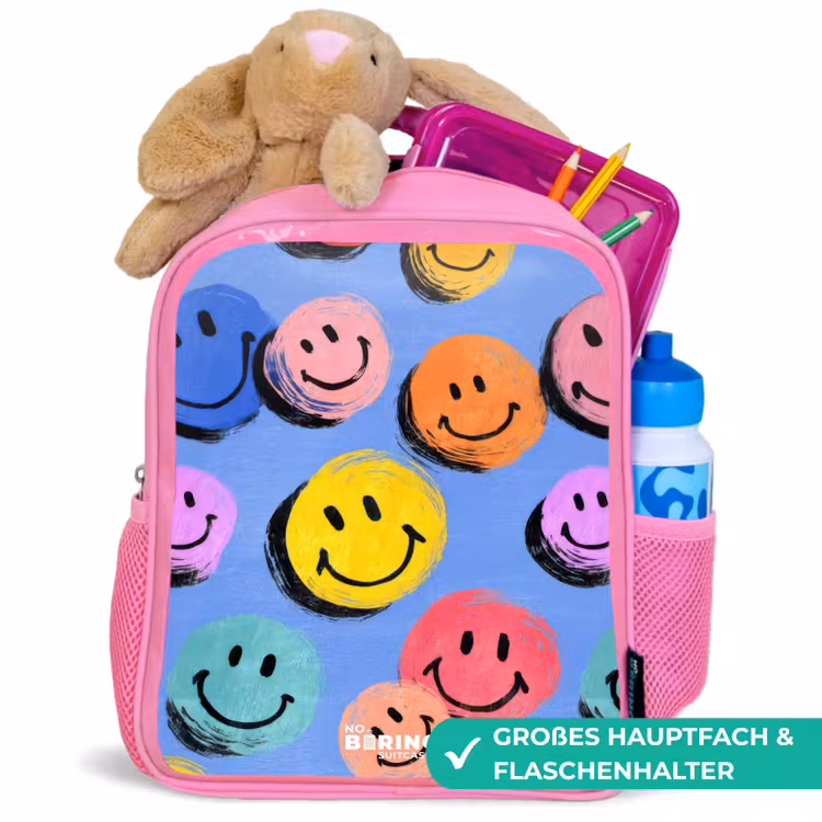 Een speels en kunstzinnig patroon van kleurrijke smileys Kinderrugzak - Roze middel -inhoud_DE