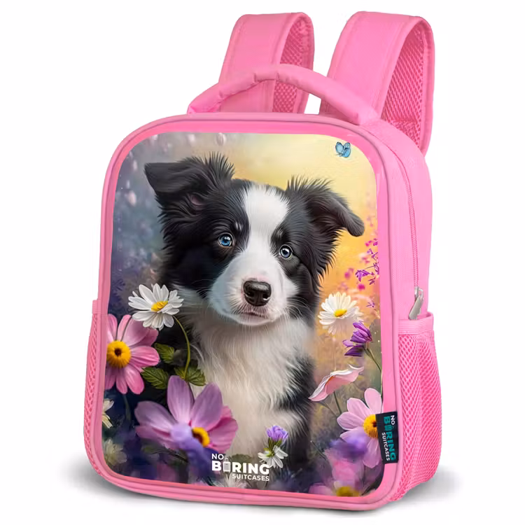 zwart witte puppy tussen kleurrijke bloemen Kinderrugzak - Roze middel -schuin